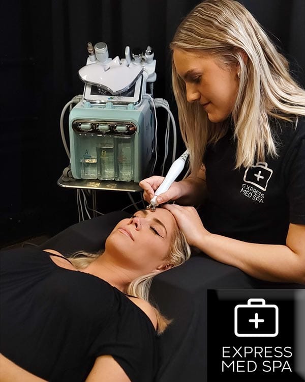 Kaitlin Knapp, licensed aesthetician at Express Med Spa, performing an Aqua Facial near me for deep pore cleansing, exfoliation, and hydration.